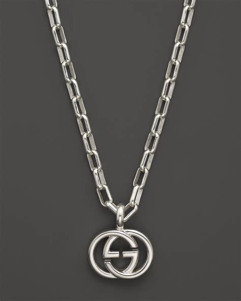 ring with double g and gucci ring|Gucci locket necklace.